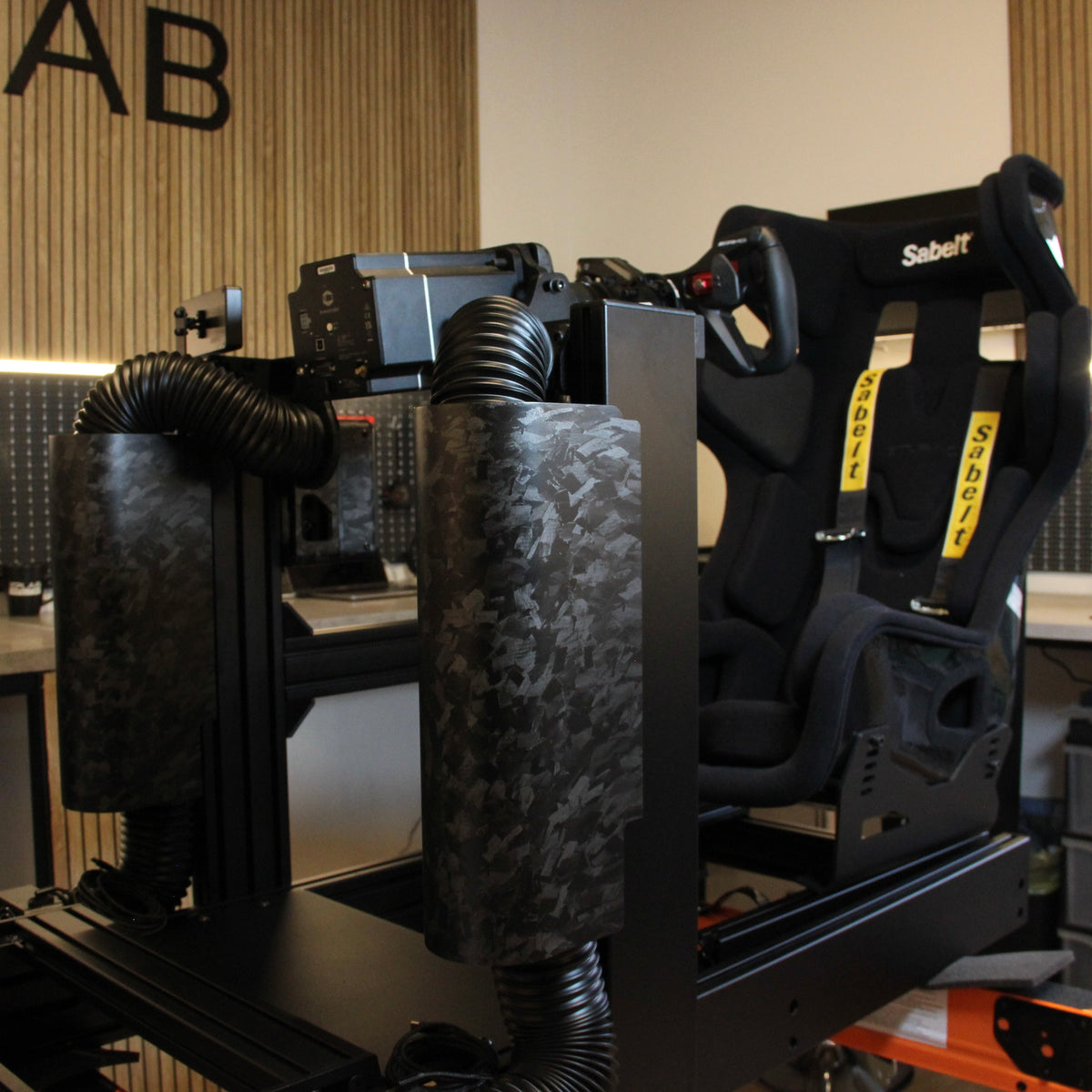 EPLAB Wind System Cover: Detail of forged carbon-look covers on a sim racing cockpit